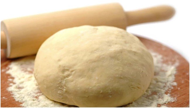 Using a Rolling Pin on Pizza Dough